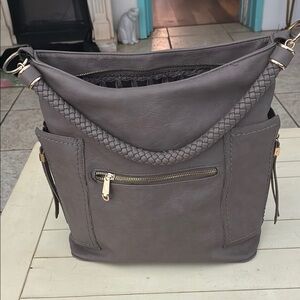 Miztique 100% PU shoulder bagpurse. Color is brown/gray with roomie zip pockets.